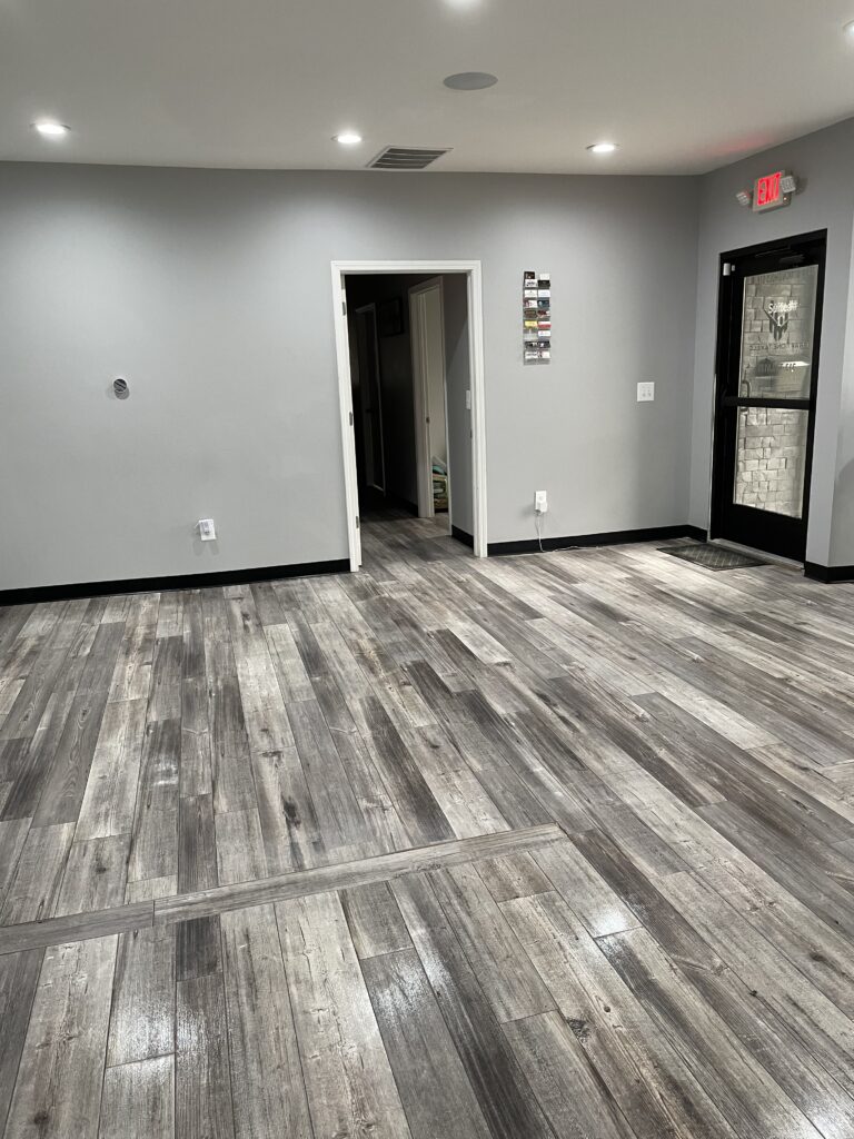 A room with a wooden style floor