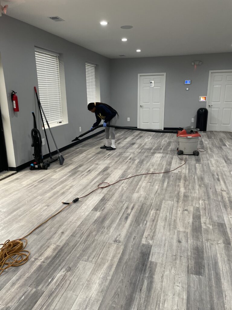 A person cleaning a room