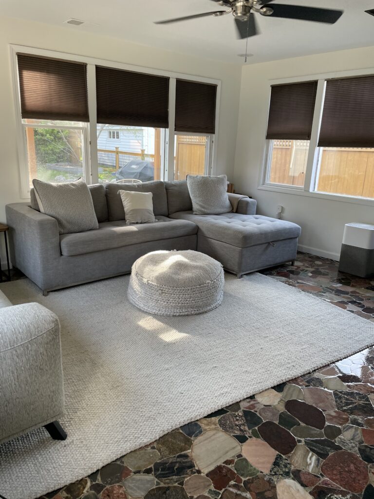 A living room with rock styled tiles